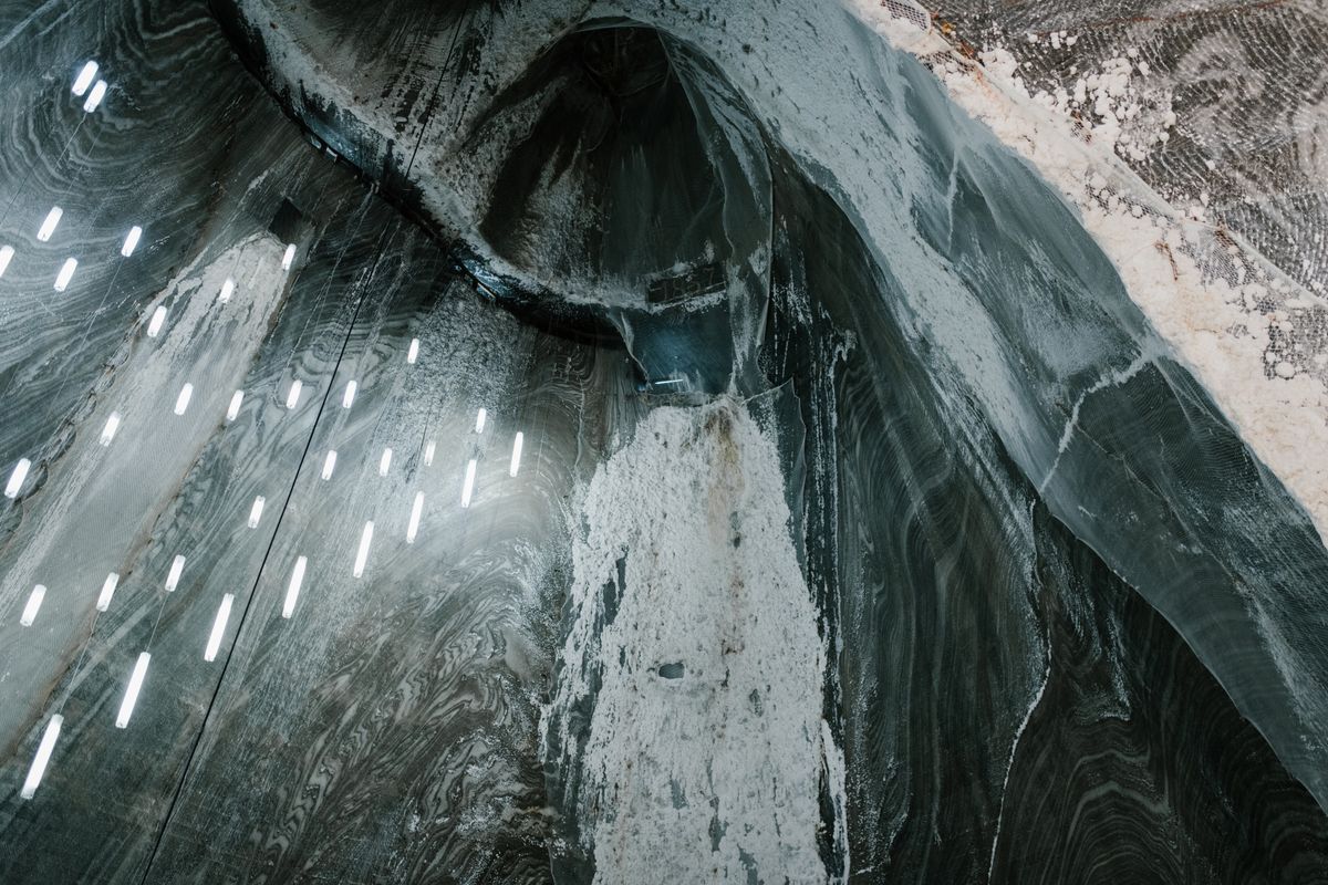 Salt walls with lamps and formations in an underground salt mine
