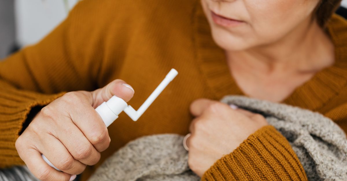 Using Mouth Spray A Woman Using a Medicine Mouth Spray · Free Stock Photo