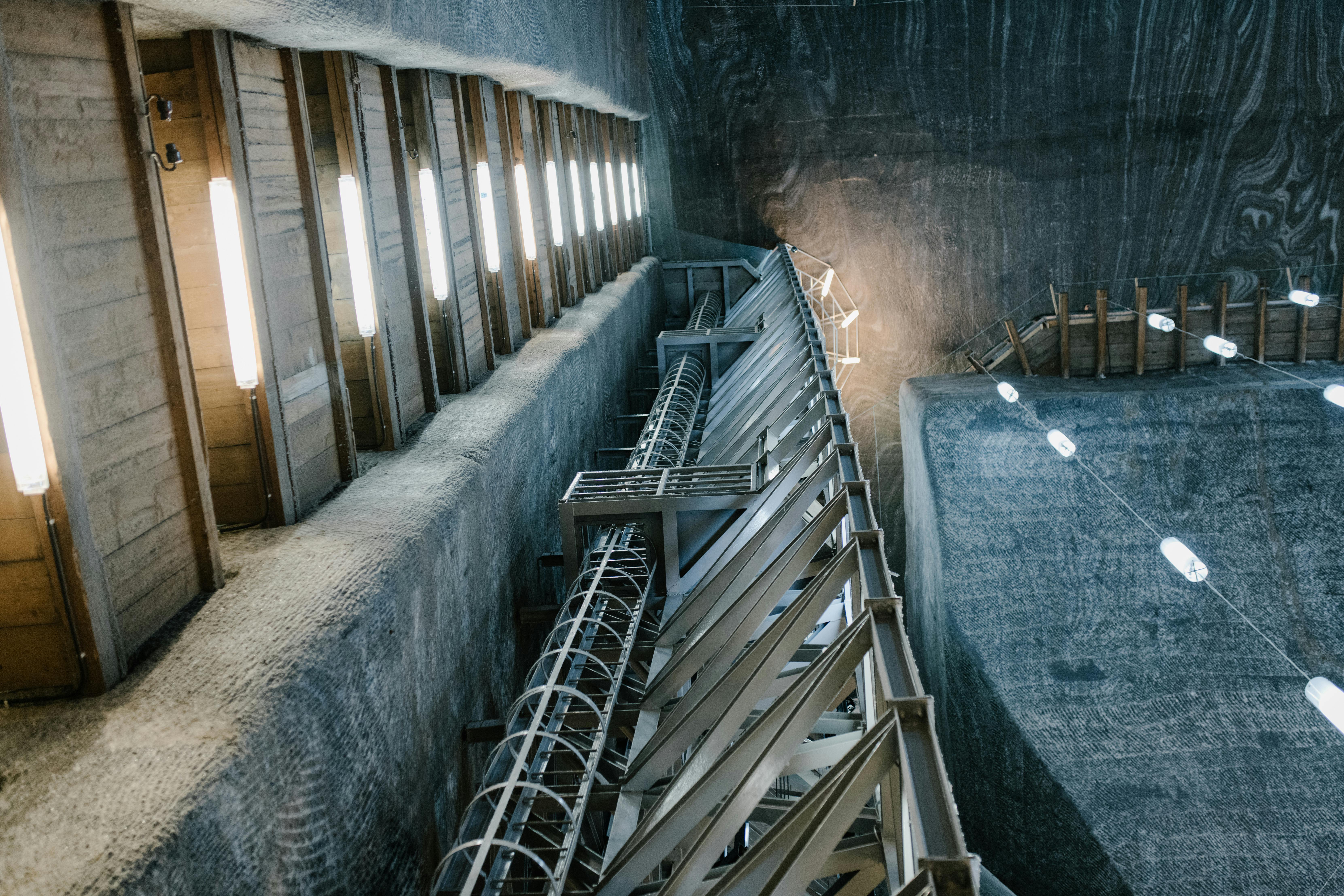 metal construction inside of salt mine with lamps