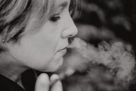 Grayscale Photo of a Smoking Woman