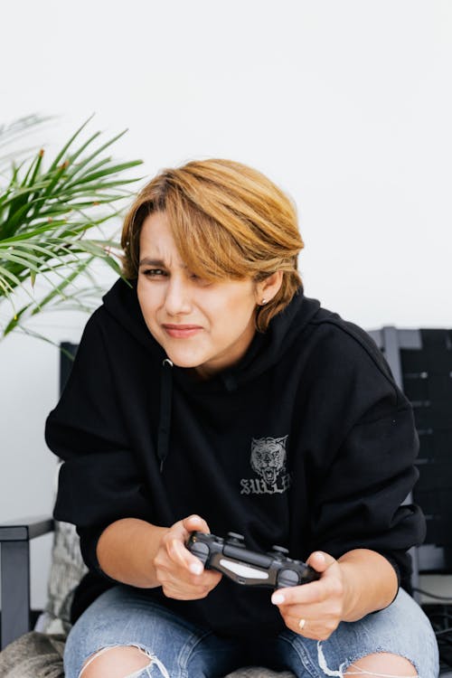 Woman Focused on Playing Video Games