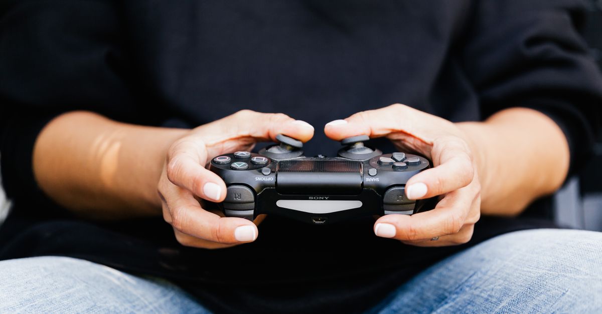 Person Using Game Controller A Close-Up Shot of a Person Using a Video Game Controller · Free Stock ...
