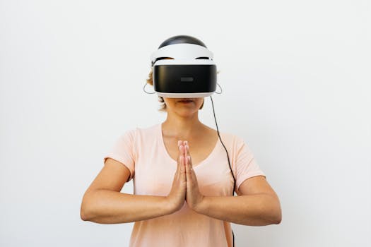 Adult woman practicing meditation with a virtual reality headset against a white background.