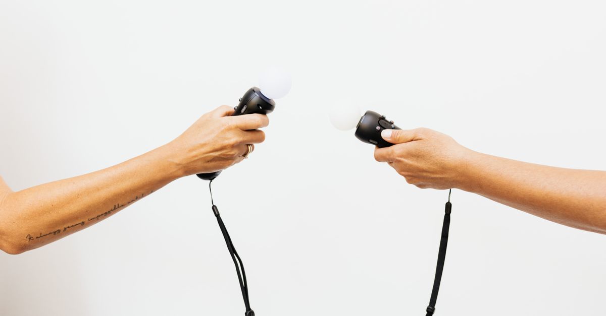 People Holding Virtual Reality Controllers · Free Stock Photo