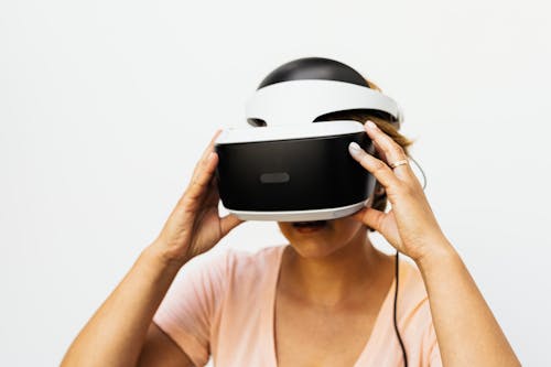 Free A Woman Wearing Virtual Reality Goggles Stock Photo