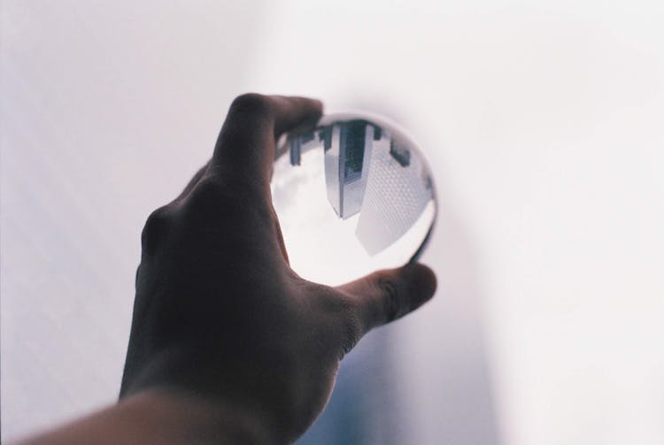 Cityscape Reflecting In Glass Ball