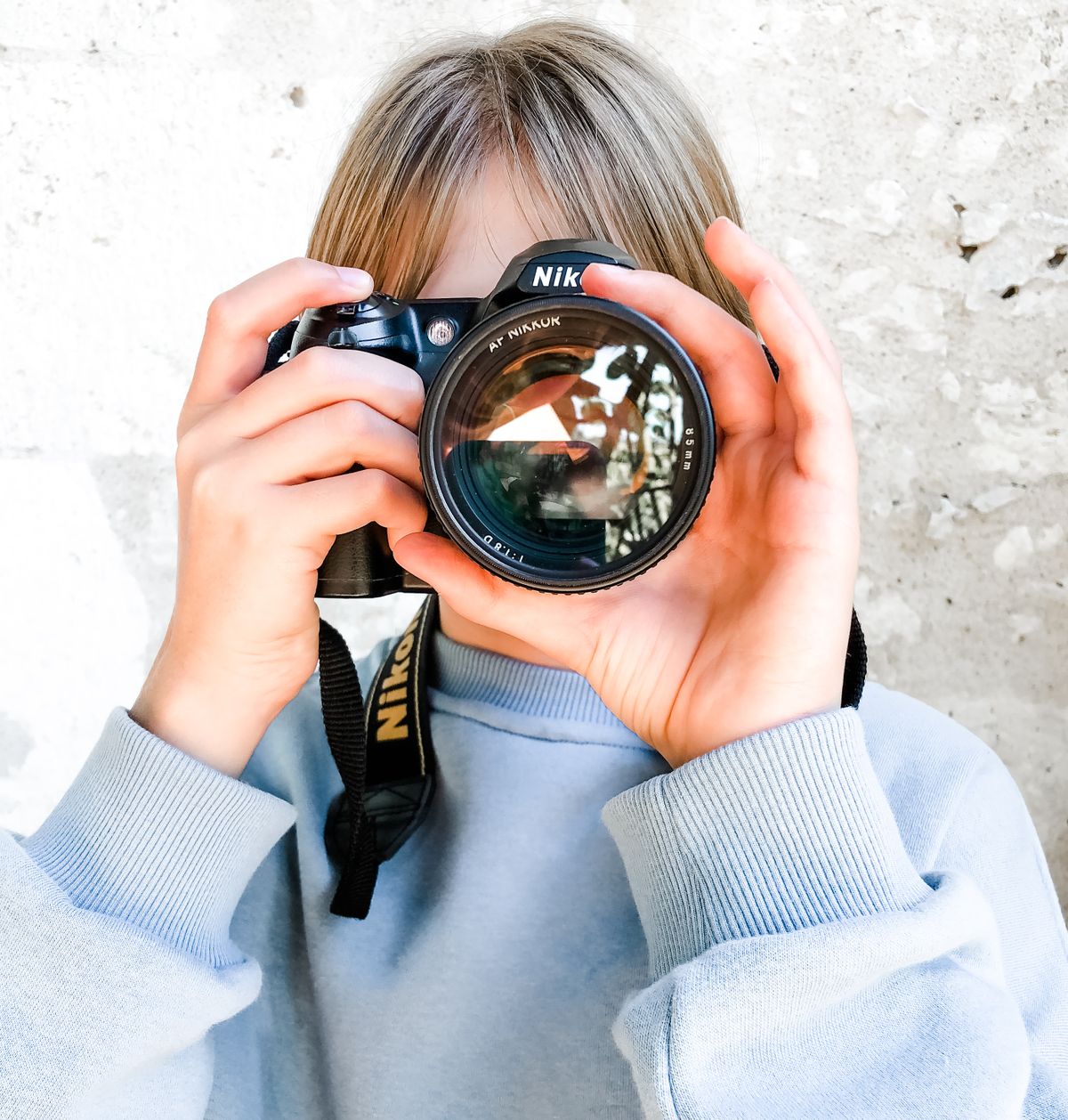 Teenager using a camera