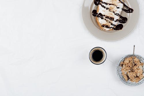 Bread with Chocolate Sauce near Coffee and Cornflakes