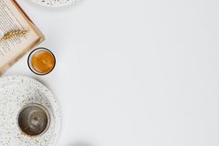 Flat lay of assorted nuts and seeds with empty space on a white background.