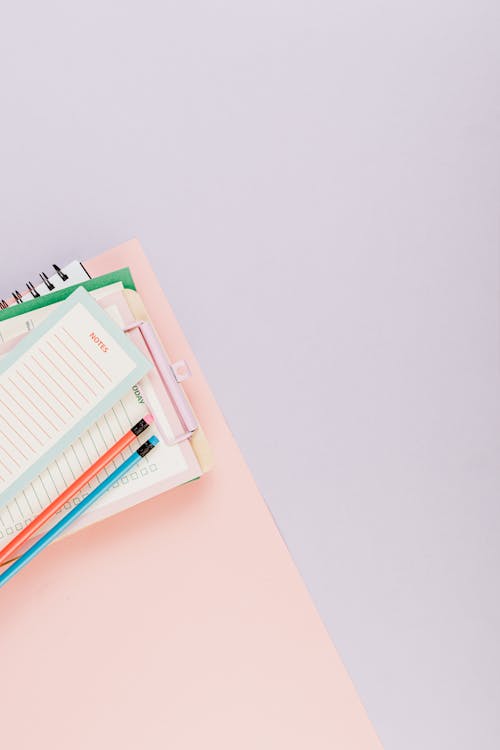Free Writing Materials on Pink Surface Stock Photo