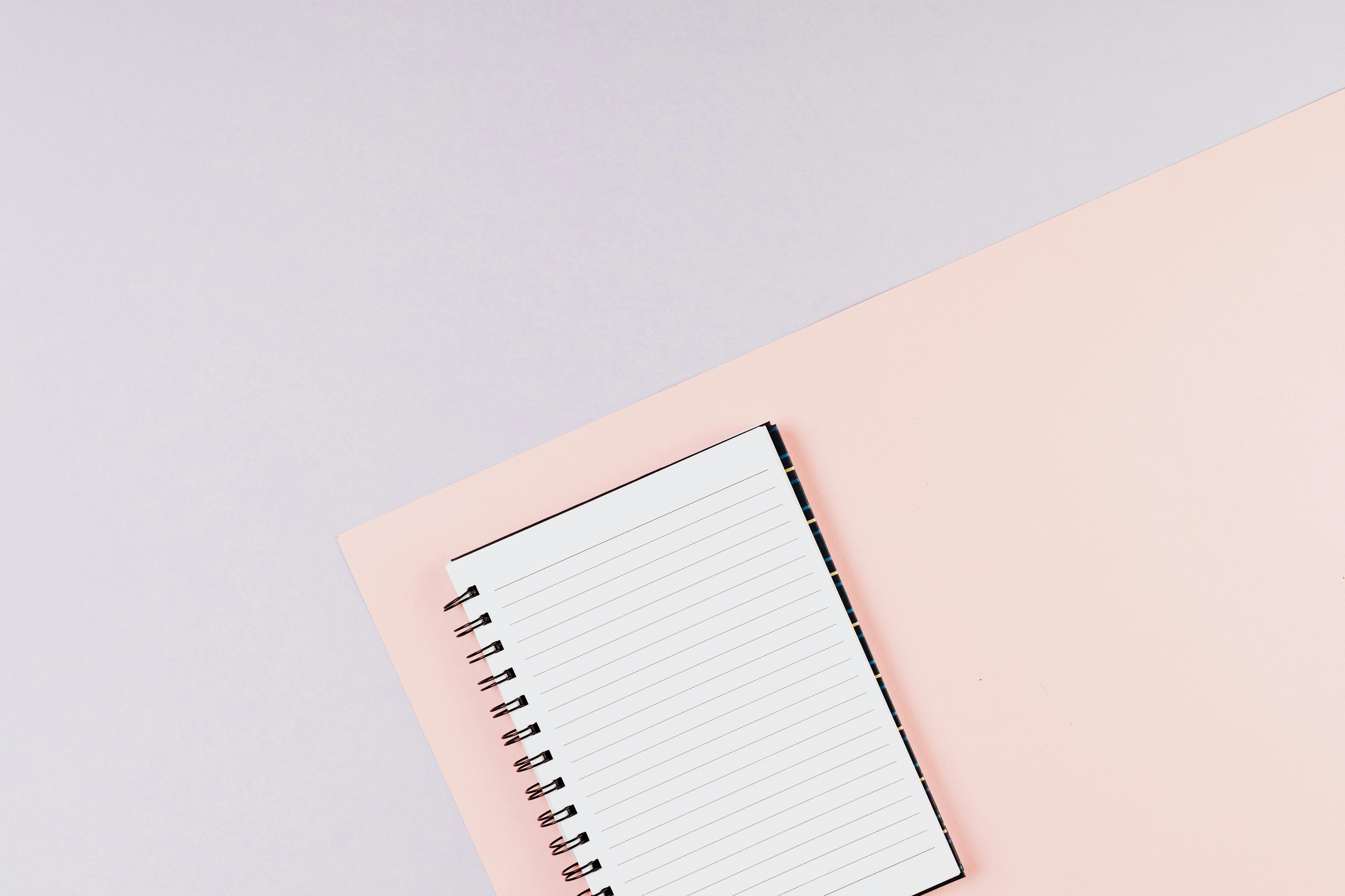 Photo of an open notebook on a white surface with plenty of space for  writing or drawing with copy space 26860154 Stock Photo at Vecteezy
