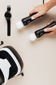 Hands holding VR controllers next to a headset. Perfect for tech enthusiasts.