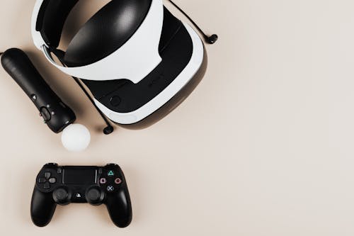 Virtual Reality Goggles and a Game Controllers on a Flat Surface