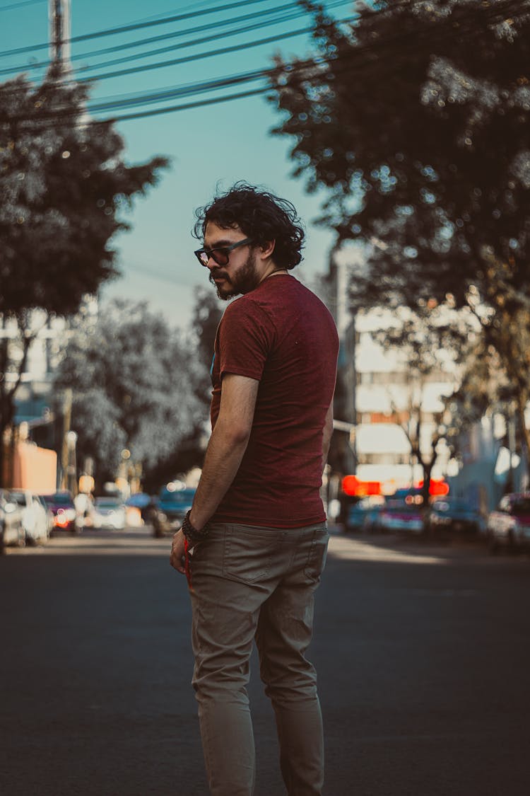 Man In A Red Shirt And A Khaki Pants 