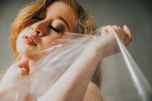 Woman with transparent plastic bag