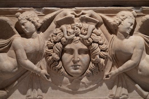 Sculpture of Medusa on a Stone Wall