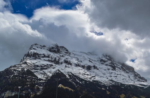 Free Snowy mountain with gray clouds on top Stock Photo