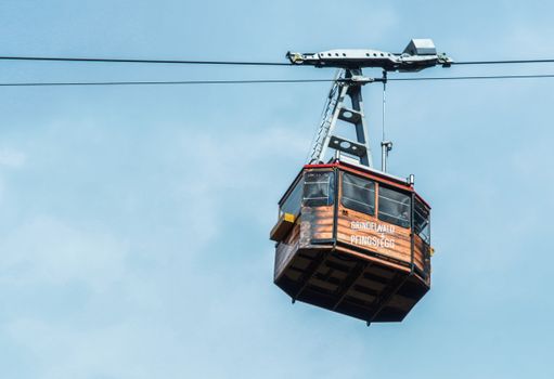 Cableway cabin against blue sky