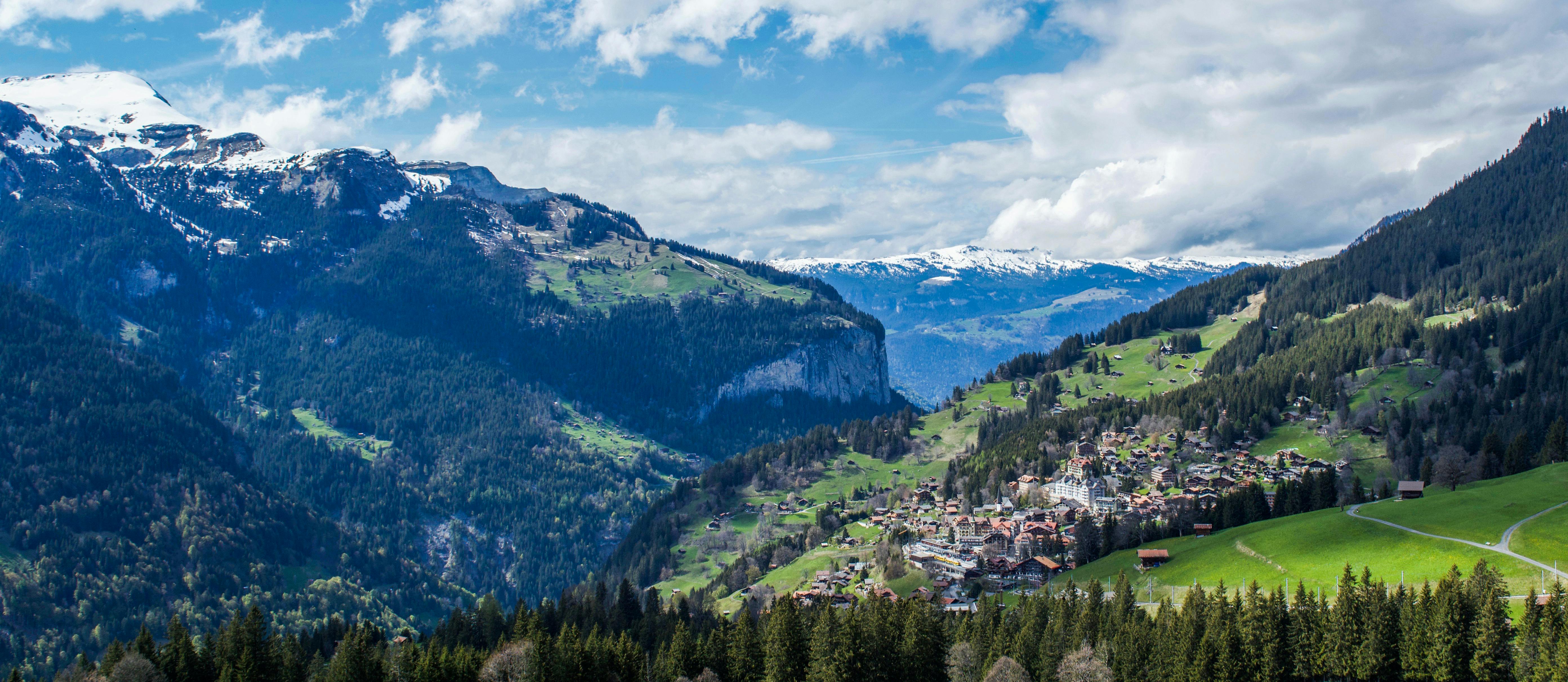 River valley between green mountains · Free Stock Photo