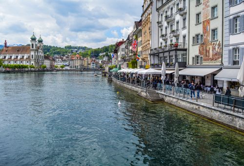 Free Calm river channel located in town with colorful buildings under cloudy sky in daytime Stock Photo