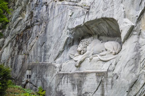 Free Old stone sculpture of dying lion in Lucerne Stock Photo