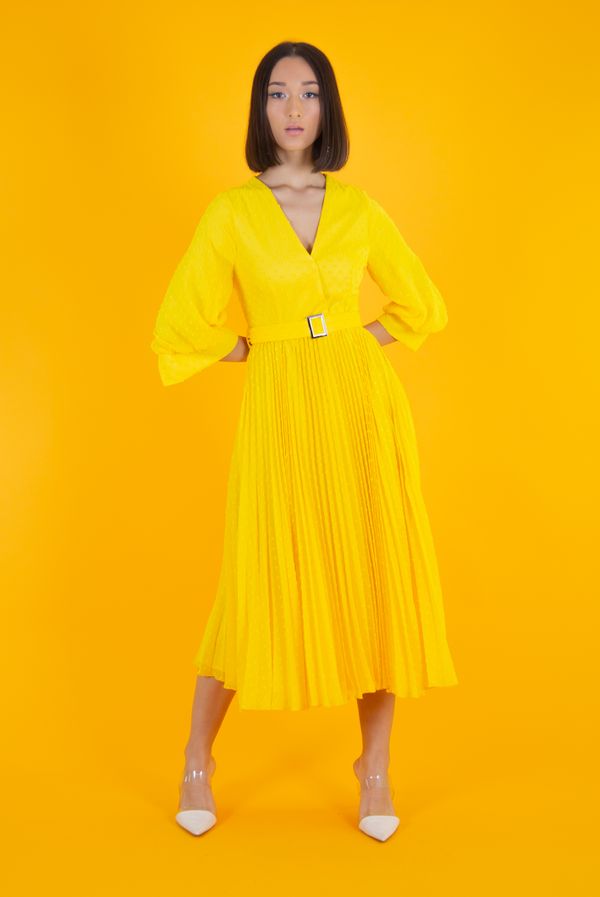 Woman in polka dot midi dress