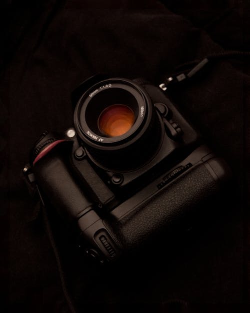 Black Dslr Camera on Black Surface