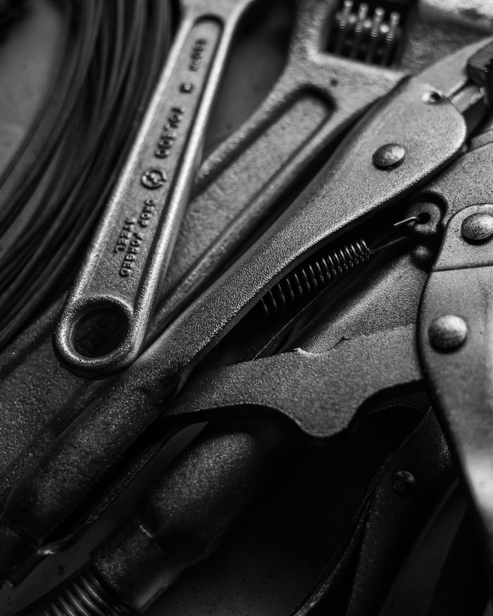 Close-up of a wrench and vice grip used in appliance repair Close-up of a wrench and vice grip used in appliance repair