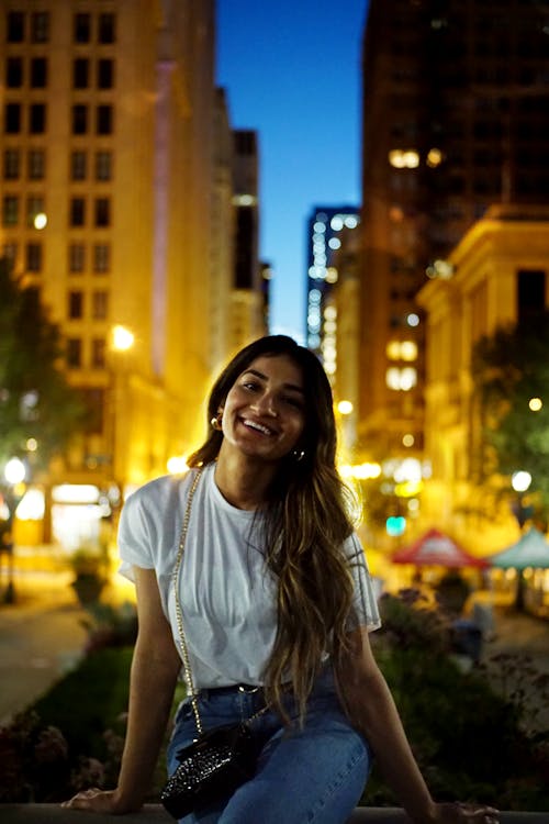 A Woman in White Crew Neck T-shirt Smiling