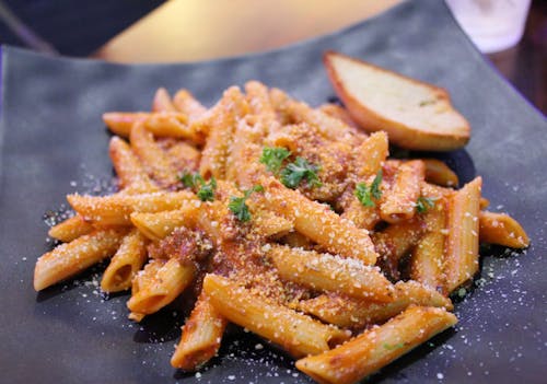 Penne Pasta Dish in Black Plate