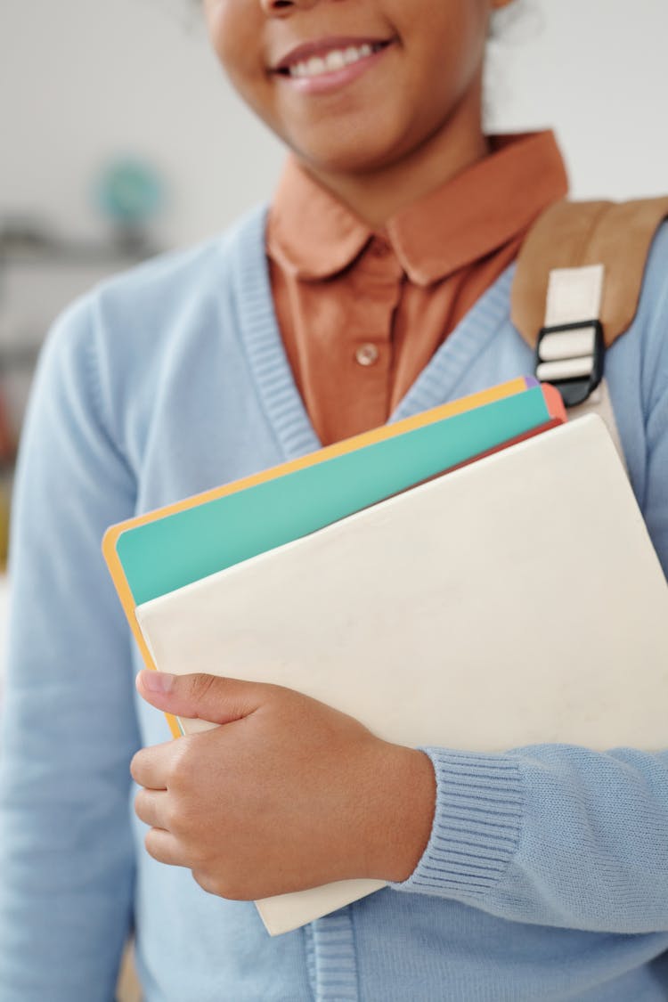 Woman Holding School Materials