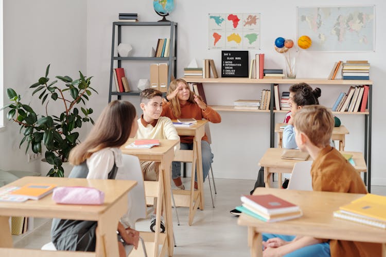 Group Of Students Sitting Inside A Classroom