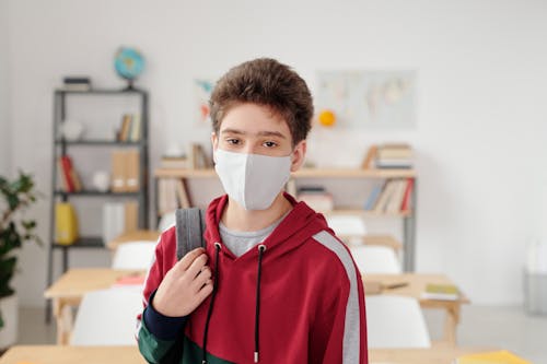 Free Boy in Hoodie With Face Mask  Stock Photo