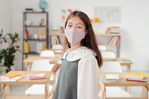 Free Girl With Face Mask in Blurred Background  Stock Photo