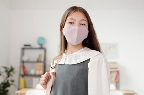 Free Female Student Wearing a Facemask Stock Photo