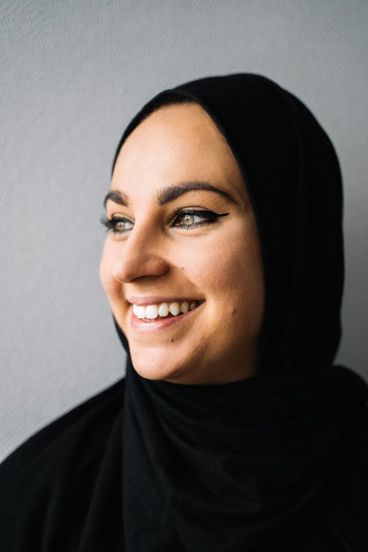 Woman In Black Hijab With Eyeliner Smiling