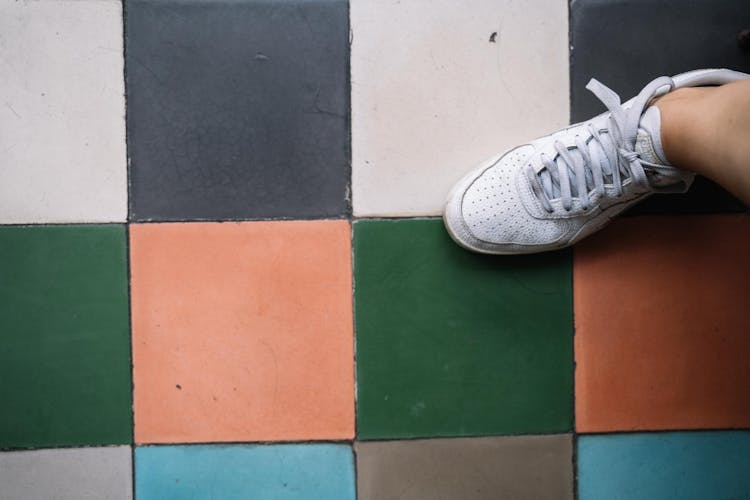 Stepping On Different Colors Of Tiles