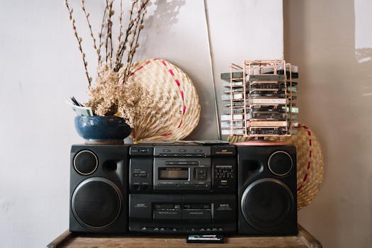A classic stereo setup with cassette tapes and dried flowers, evoking a nostalgic vintage vibe.