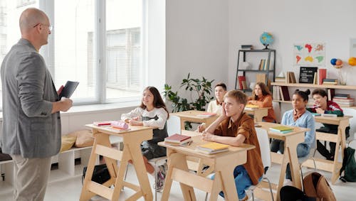 Free Students Sitting in the Classroom Stock Photo