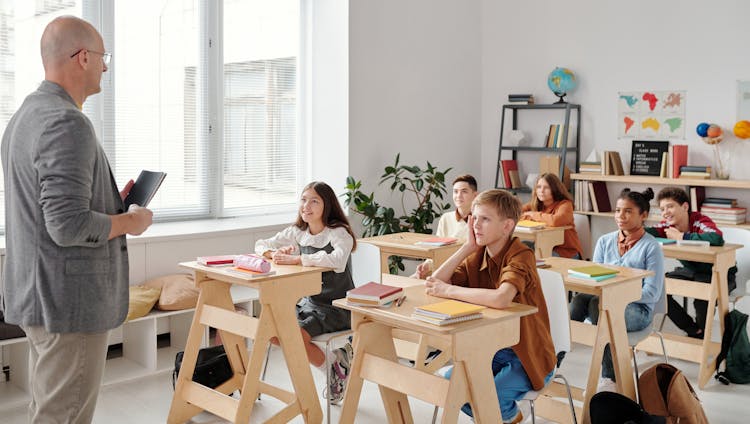 Students Sitting In The Classroom