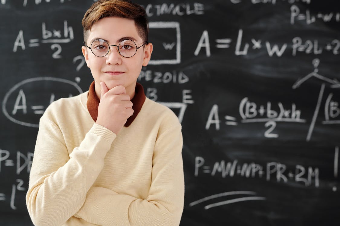 Man in Sweater Wearing Black Framed Eyeglasses