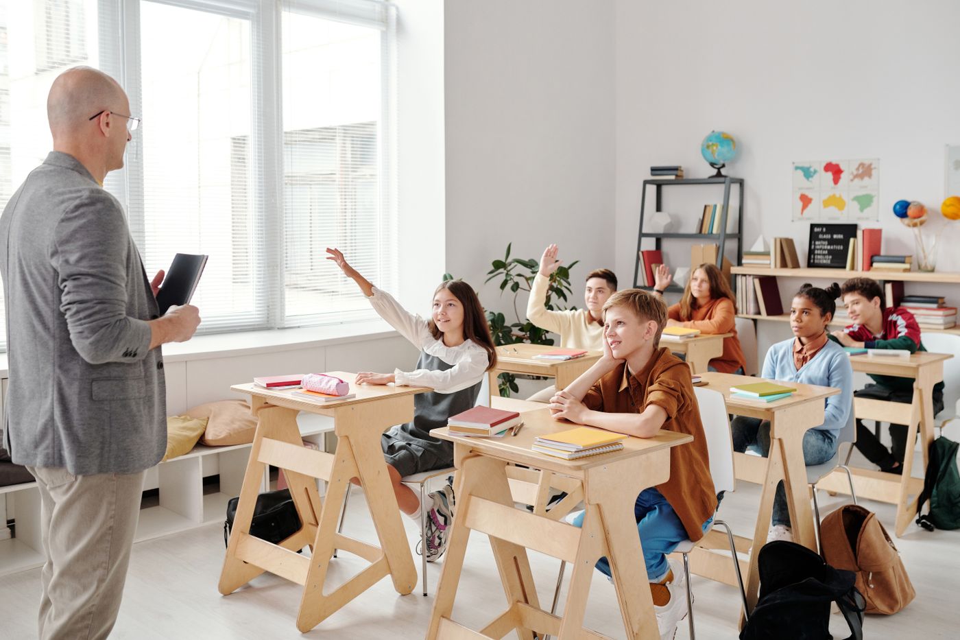 Instructor speaking with adult students in a classroom