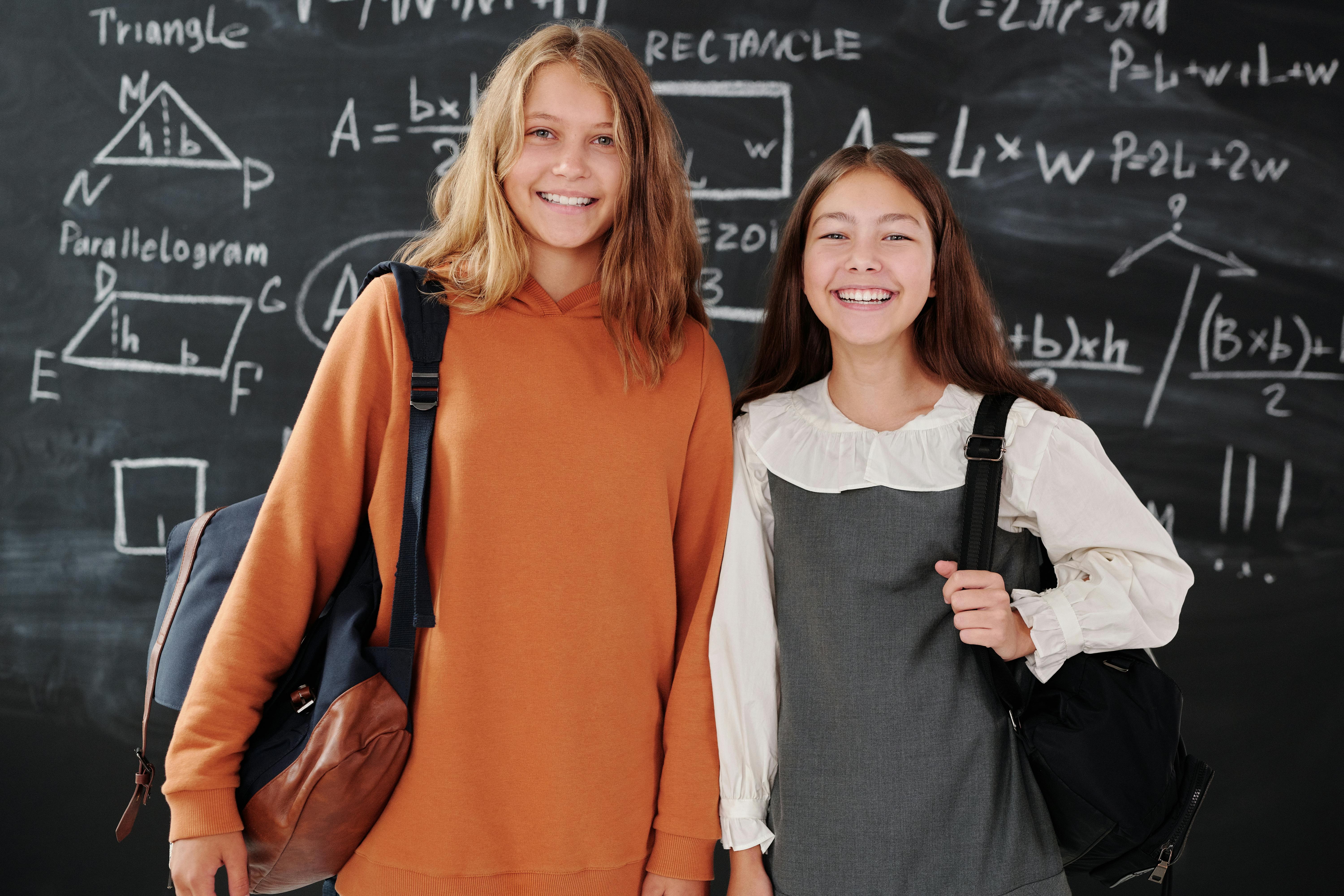 Girls Smiling while Looking at Camera · Free Stock Photo