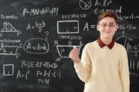 A Boy Holding a Chalk