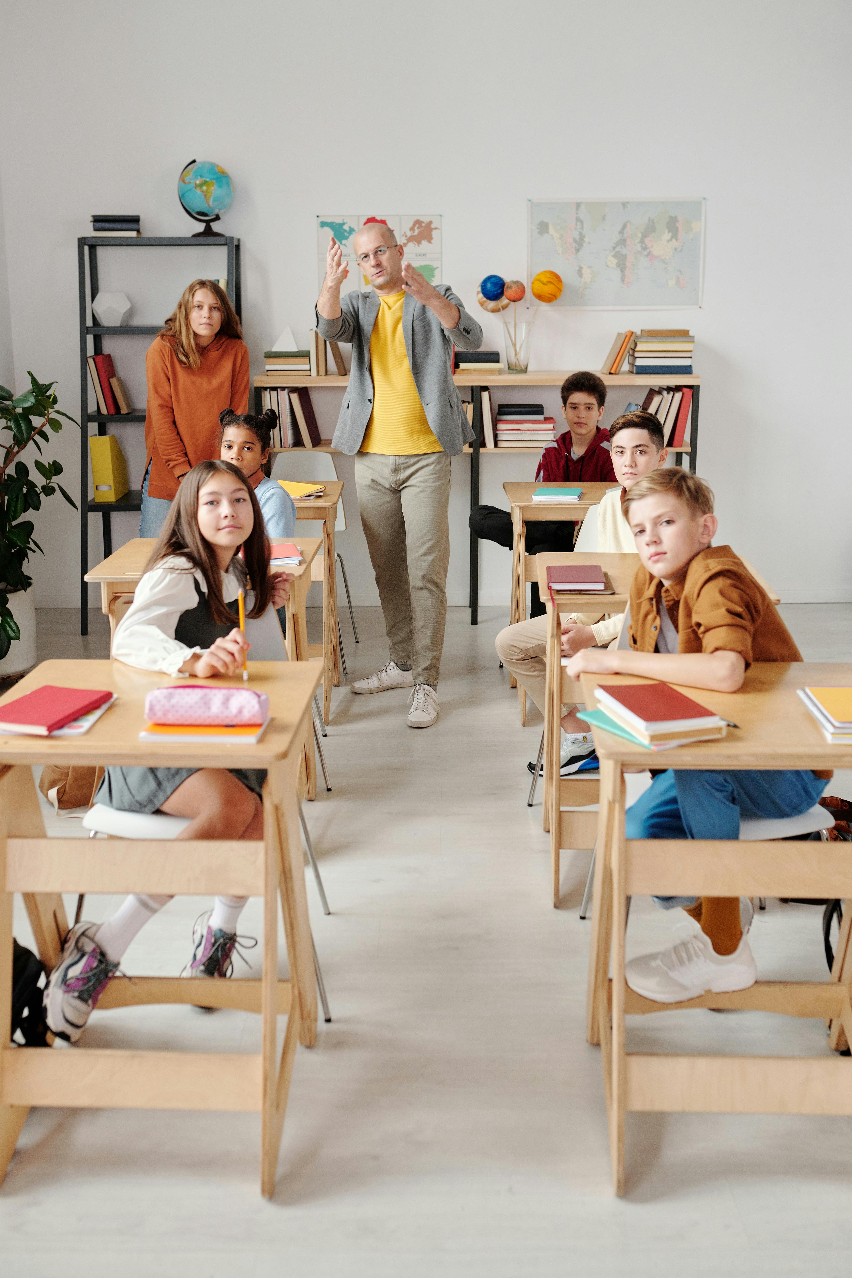 teacher with his students in the classroom