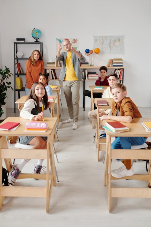 Free Teacher with His Students in the Classroom Stock Photo