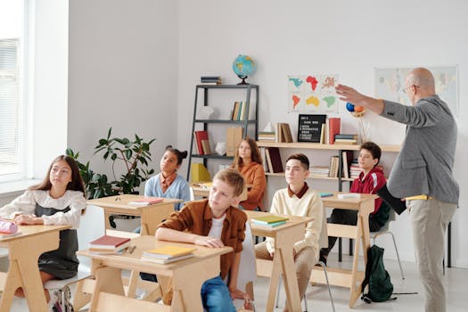 A diverse group of students attentively participating in a classroom lesson led by a teacher.