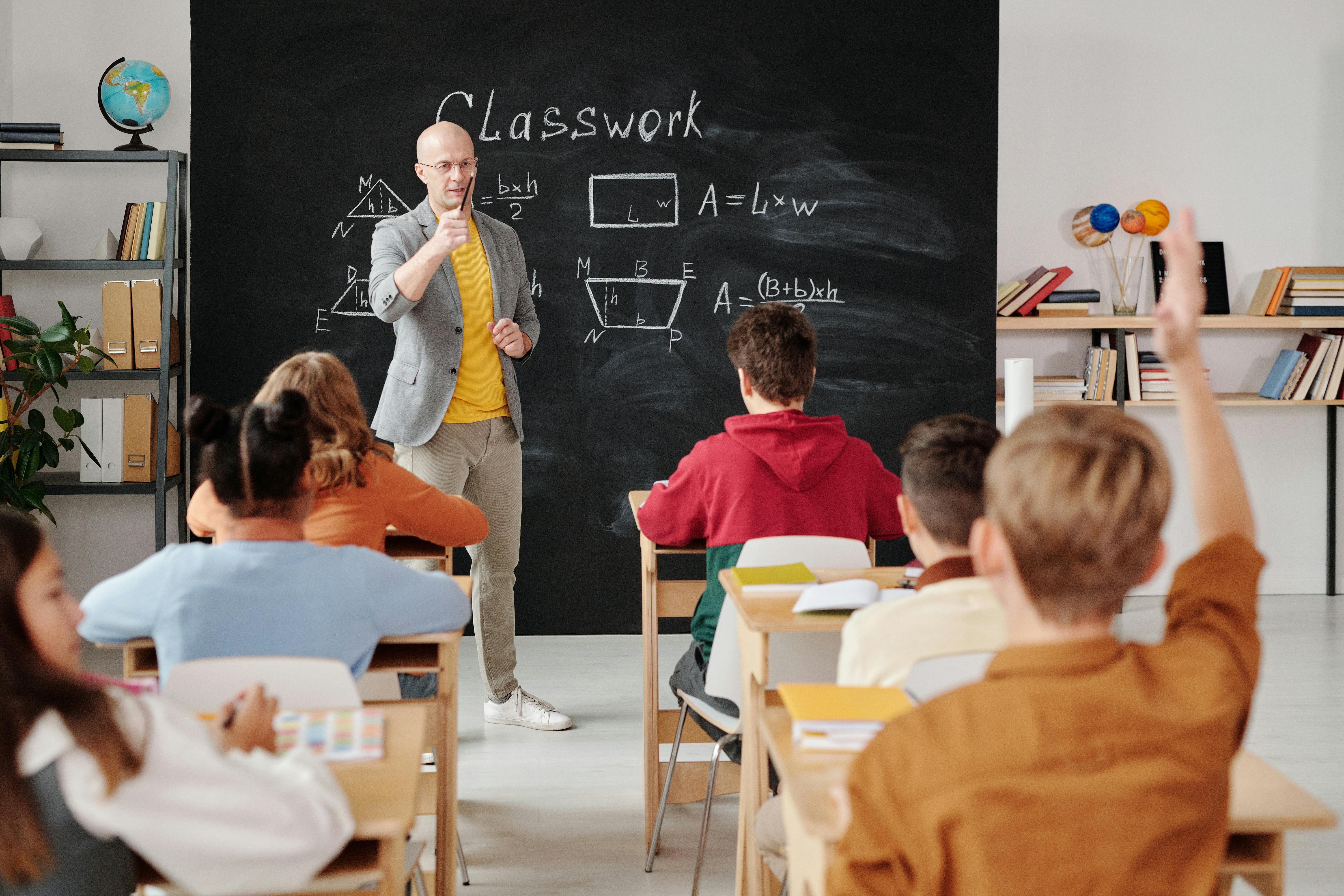 Teacher Posing With Students Stock Photo - Download Image Now - 30