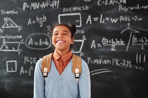 Smiling Girl Carrying a Backpack