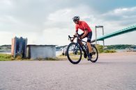 Man in Red Shirt Riding on Bicycle